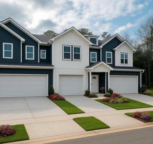 view of front of property featuring a garage, driveway, and board and batten siding