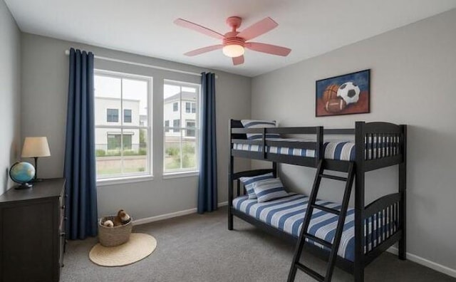 bedroom featuring carpet floors, baseboards, and a ceiling fan
