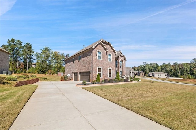 view of front of home with a garage and a front lawn