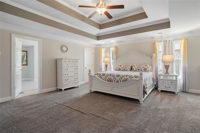 bedroom featuring carpet, ceiling fan, a raised ceiling, and crown molding