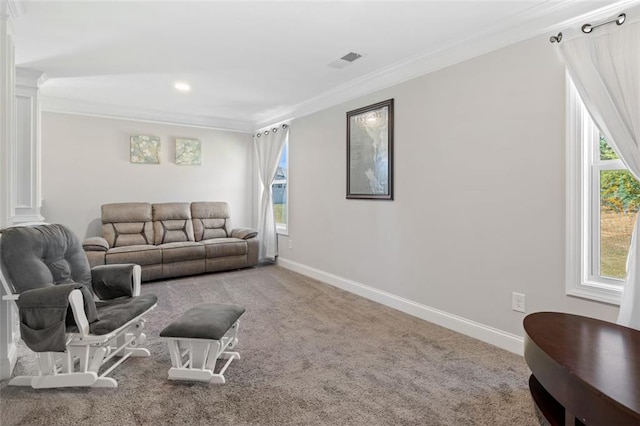 living room with carpet flooring, decorative columns, and ornamental molding