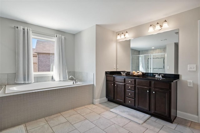 bathroom featuring plus walk in shower and vanity