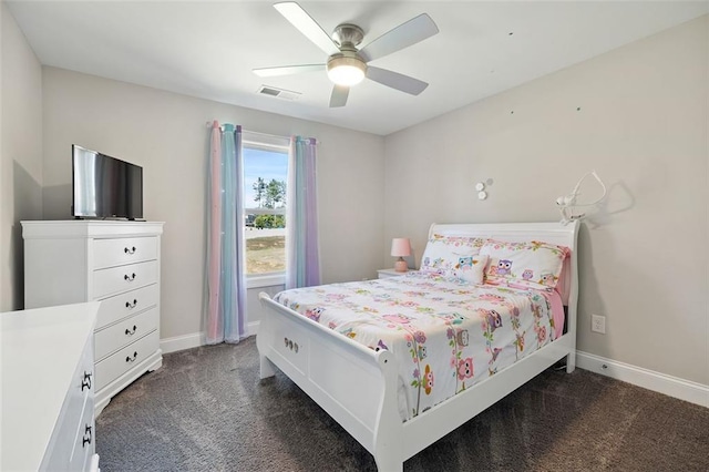 bedroom featuring ceiling fan and dark carpet