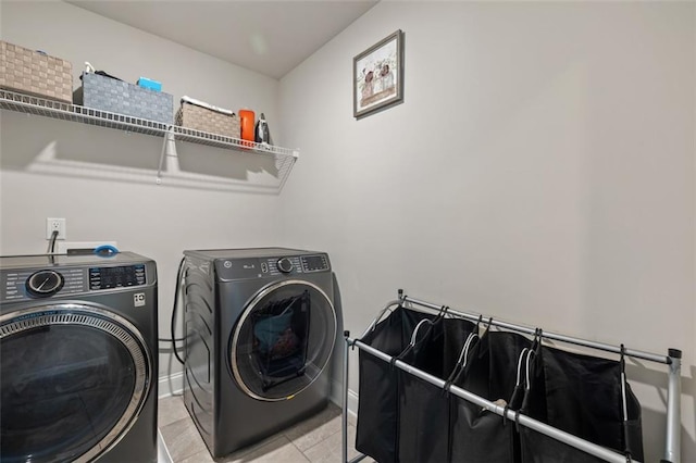 washroom featuring washer and clothes dryer