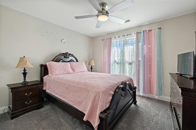 bedroom with ceiling fan and dark colored carpet