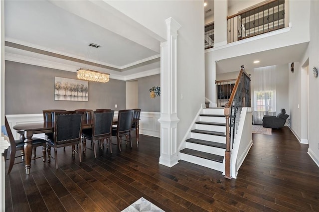 dining area with a chandelier, dark hardwood / wood-style floors, and ornamental molding