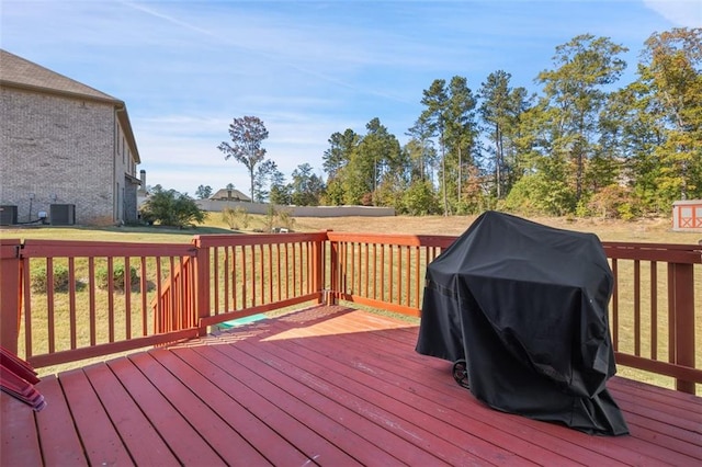 wooden terrace with grilling area and central AC unit