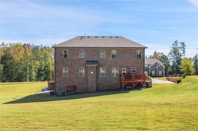 back of house with a yard and a deck