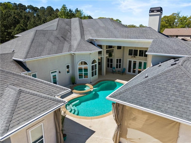 view of pool featuring a patio area and french doors