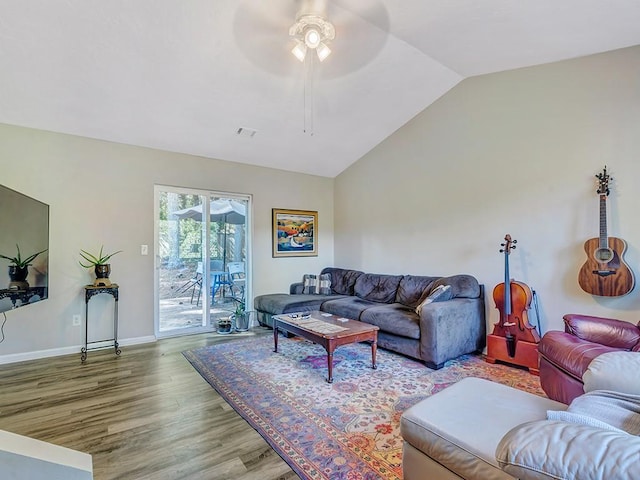 living room featuring lofted ceiling, hardwood / wood-style flooring, and ceiling fan