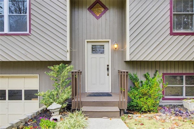 property entrance with a garage