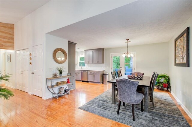 dining room featuring a chandelier and light wood-type flooring