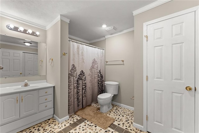 bathroom featuring crown molding, vanity, and toilet