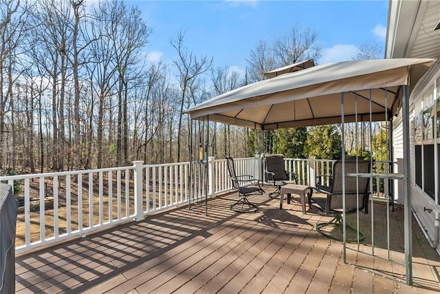 wooden deck featuring a gazebo