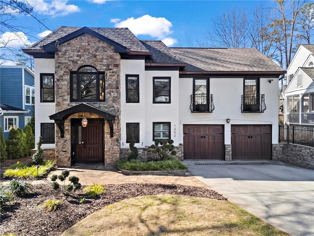 view of front of property with a garage, concrete driveway, a shingled roof, and stucco siding