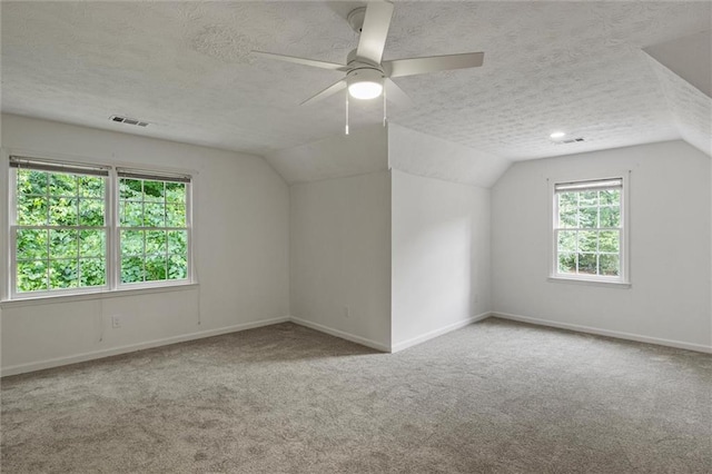 4220 Singing Post Ln NE, Roswell, GA 30075 - bonus room with carpet floors, lofted ceiling, a textured ceiling, a ceiling fan, and baseboards