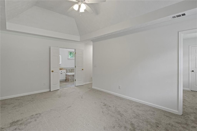 4220 Singing Post Ln NE, Roswell, GA 30075 - unfurnished bedroom featuring carpet floors, baseboards, ensuite bath, and a raised ceiling