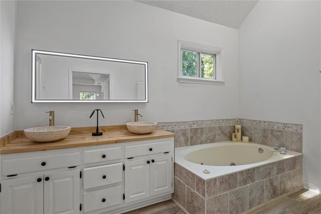 4220 Singing Post Ln NE, Roswell, GA 30075 - full bath with a whirlpool tub, double vanity, and wood finished floors