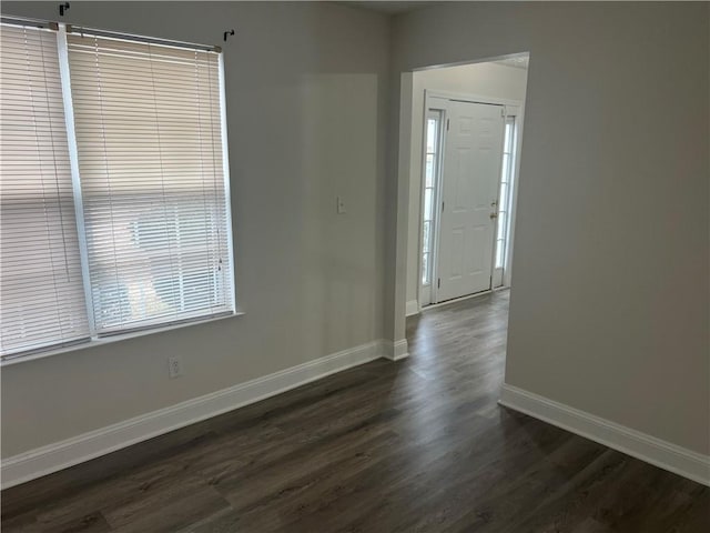 foyer entrance with dark hardwood / wood-style flooring