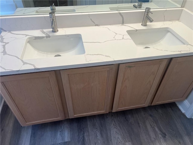 bathroom featuring vanity and hardwood / wood-style floors