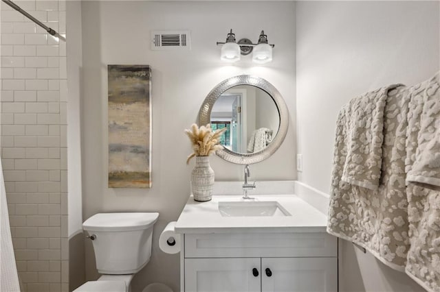 full bath with toilet, vanity, and a shower
