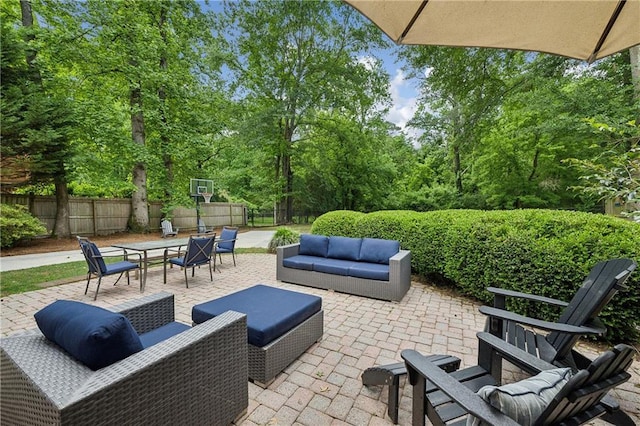 view of patio / terrace with an outdoor hangout area, a fenced backyard, and outdoor dining area