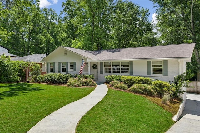 ranch-style house featuring brick siding