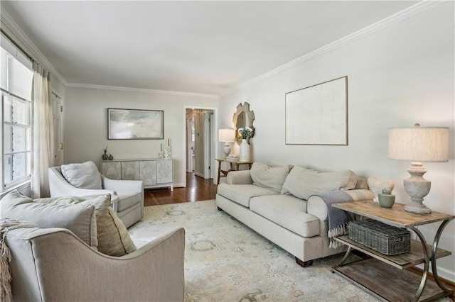 living area with ornamental molding and wood finished floors