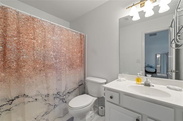 bathroom with toilet, vanity, a shower with shower curtain, and tile patterned floors