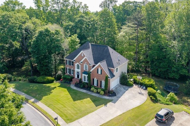 view from above of property featuring a forest