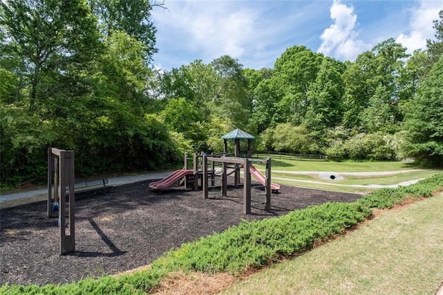 community jungle gym with a lawn