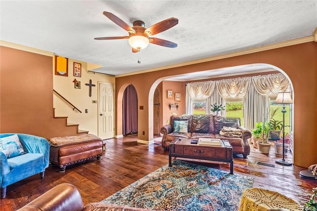 150 Wilbanks St, Buford, GA 30518 - living area featuring arched walkways, a ceiling fan, wood-type flooring, a textured ceiling, and ornamental molding