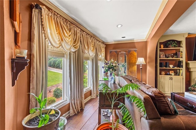 150 Wilbanks St, Buford, GA 30518 - living area featuring light wood finished floors, crown molding, recessed lighting, and baseboards