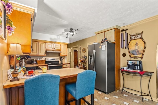 150 Wilbanks St, Buford, GA 30518 - kitchen with appliances with stainless steel finishes, under cabinet range hood, a sink, a peninsula, and light countertops