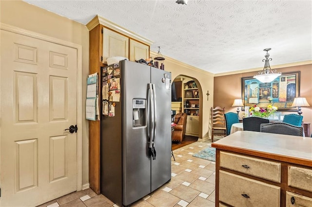 150 Wilbanks St, Buford, GA 30518 - kitchen with stainless steel fridge with ice dispenser, arched walkways, decorative light fixtures, a textured ceiling, and light tile patterned floors