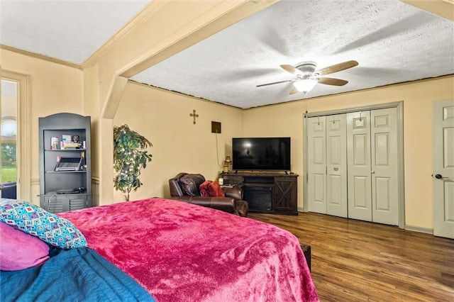 150 Wilbanks St, Buford, GA 30518 - bedroom with wood finished floors, a ceiling fan, a closet, a textured ceiling, and crown molding