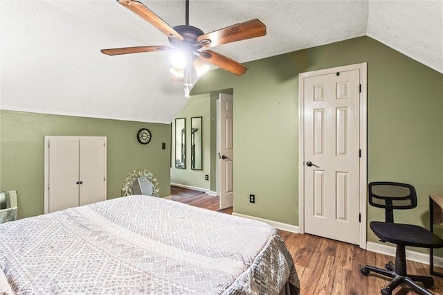 150 Wilbanks St, Buford, GA 30518 - bedroom featuring vaulted ceiling, baseboards, wood finished floors, a textured ceiling, and ceiling fan