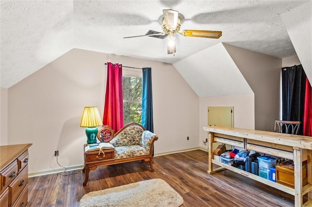 150 Wilbanks St, Buford, GA 30518 - living area featuring wood finished floors, vaulted ceiling, baseboards, ceiling fan, and a textured ceiling