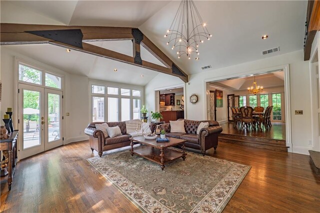living area featuring visible vents, wood finished floors, high vaulted ceiling, french doors, and a notable chandelier