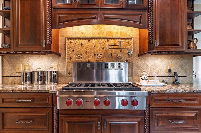 kitchen featuring light stone counters, open shelves, stainless steel gas cooktop, and tasteful backsplash