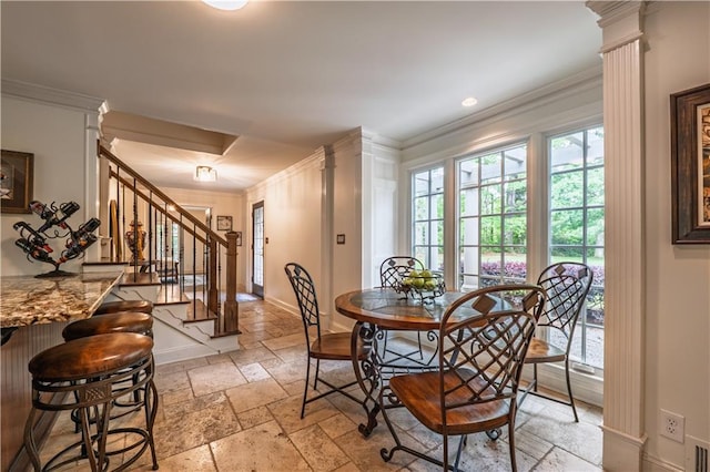 dining area with stairway, baseboards, ornamental molding, ornate columns, and stone tile floors