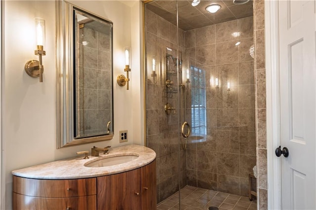 bathroom featuring a shower stall and vanity