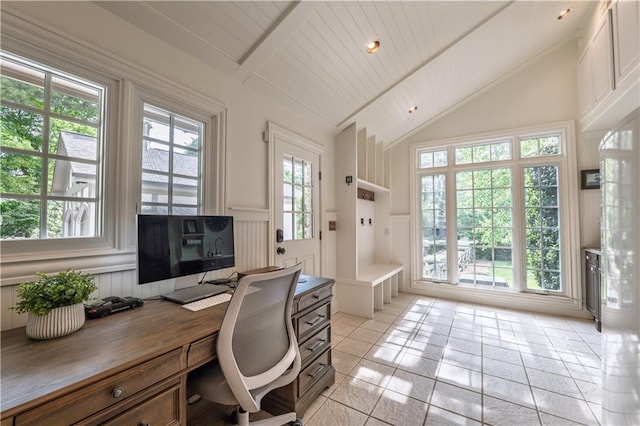 office featuring light tile patterned floors, a wealth of natural light, and a decorative wall