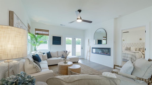 1846 Butterfly Way, Marietta, GA 30066 - living room featuring a ceiling fan, wood finished floors, and a glass covered fireplace