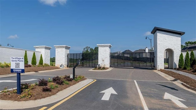 1846 Butterfly Way, Marietta, GA 30066 - view of asphalt street with a gate, curbs, and street lighting