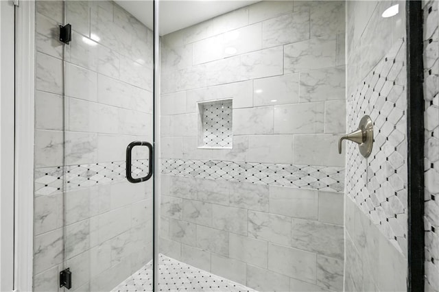 full bath featuring a shower stall