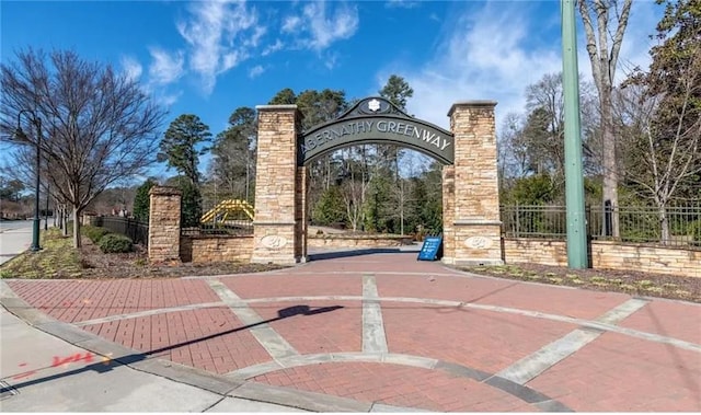 view of gate with fence