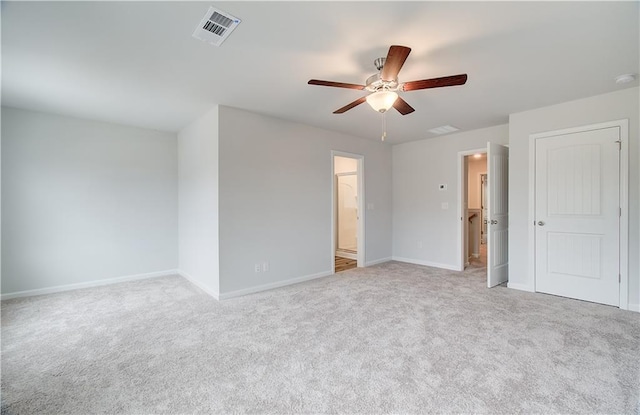 empty room featuring light carpet and ceiling fan