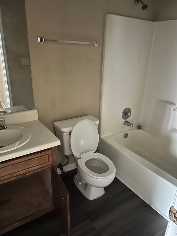 432 Manor Estates Dr, Stockbridge, GA 30281 - full bathroom with toilet,  shower combination, wood finished floors, and vanity