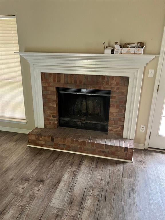 432 Manor Estates Dr, Stockbridge, GA 30281 - detailed view of wood finished floors, a fireplace, and baseboards